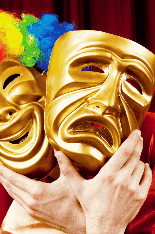 En glad og ked af det maske.